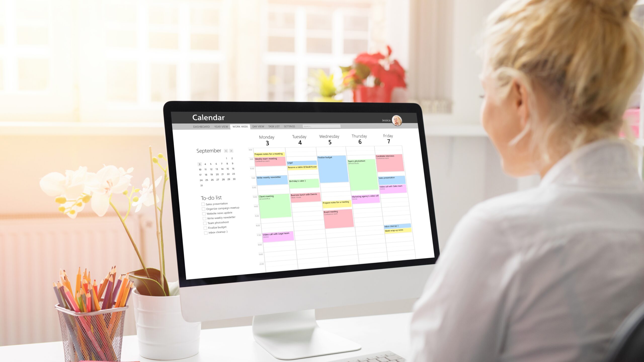 An Office Staff checking the schedule for the month