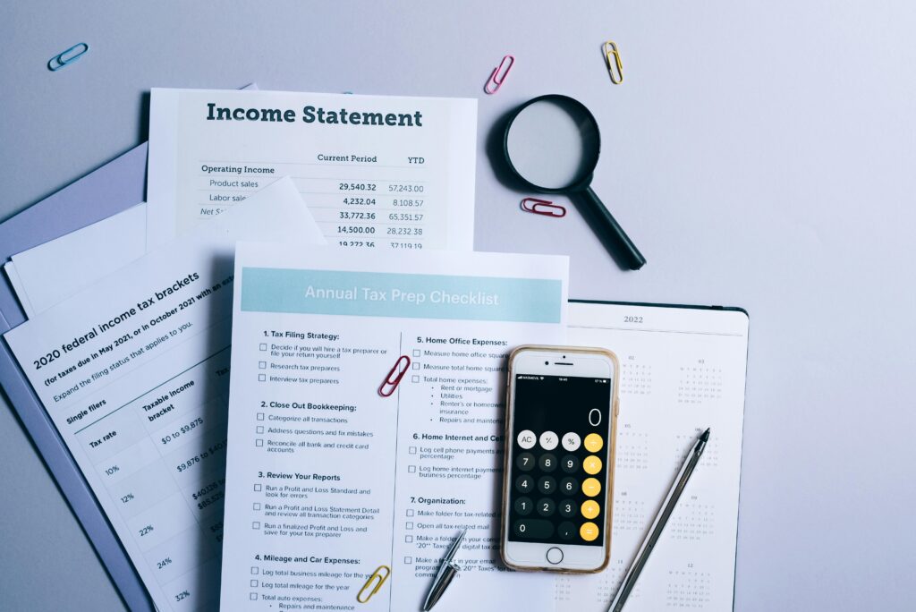 A photo showing some tax checklist, forms and financial statements